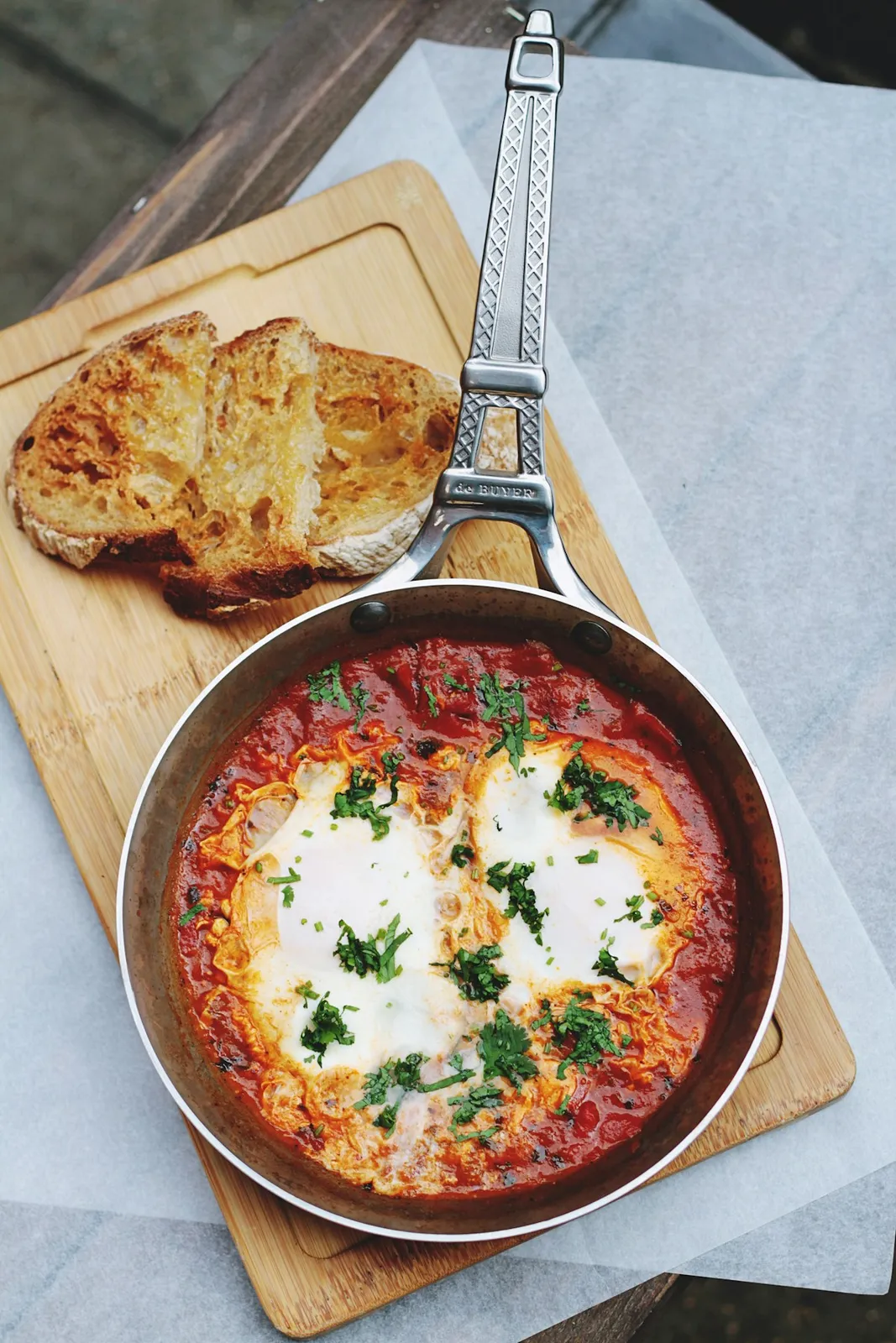 Shakshuka with poached eggs in spiced tomato sauce